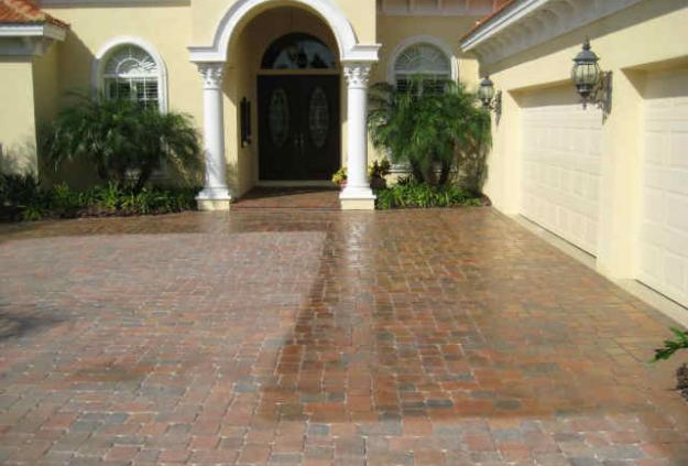 Freshly installed brick paver driveway at a Florida Mediterranean-style home in Lutz, FL by Paver Rescue