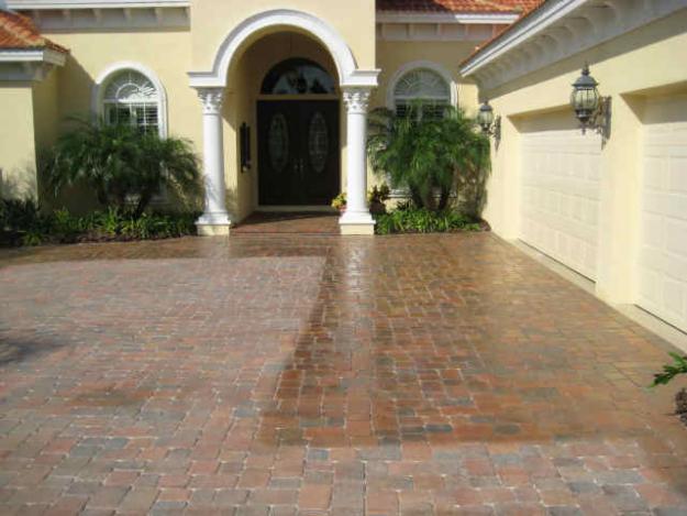 Freshly installed brick paver driveway at a Florida Mediterranean-style home in Lutz, FL by Paver Rescue